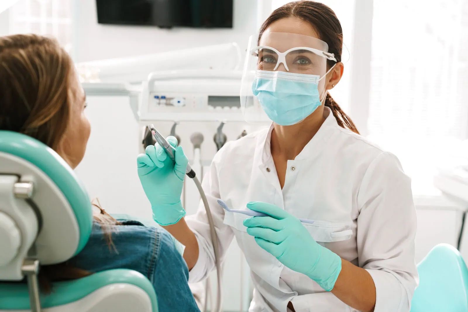 Dental Care of Stamford team welcoming a patient